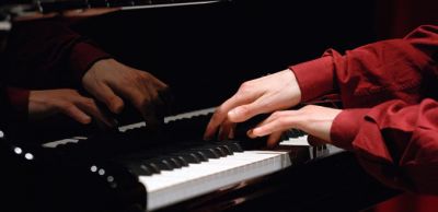 A quattro mani